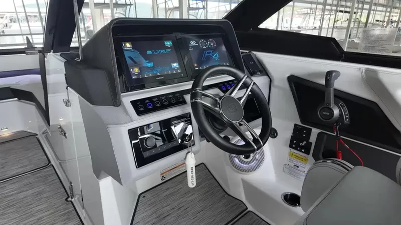 Slide: The Image of The 2026 Cobalt R4 Surf cockpit features a modern dashboard with touchscreen and steering wheel. - 16