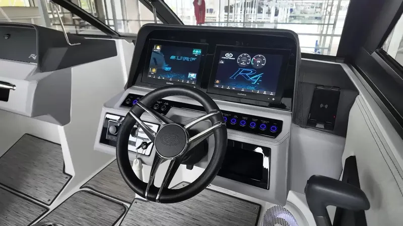 Slide: The Image of The cockpit of the 2026 Cobalt R4 Surf features a modern steering wheel and digital displays. - 25