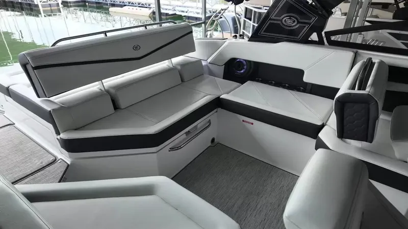 Slide: The Image of The image shows the luxurious interior of a Cobalt R4 Surf boat with sleek seating. - 50