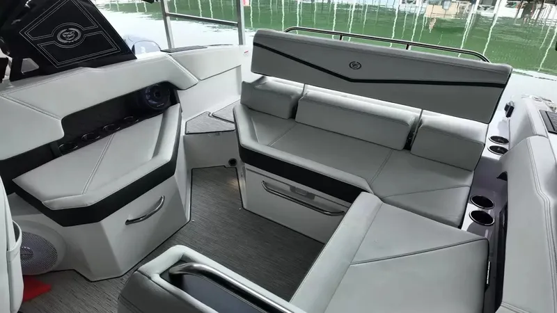 Slide: The Image of The image shows the interior of a 2026 Cobalt R4 Surf boat with sleek, upholstered seating. - 49