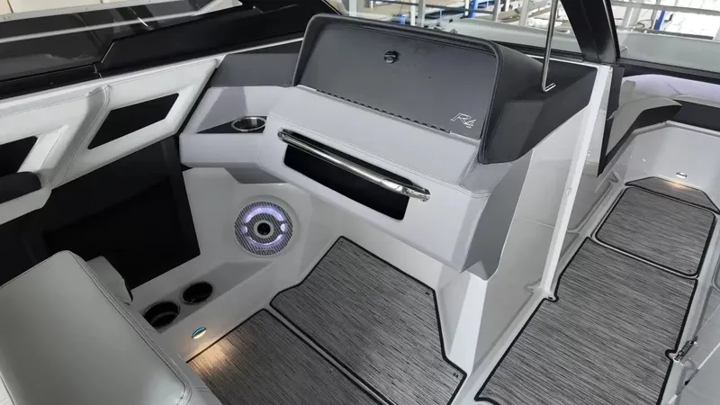 Slide: The Image of The image shows the modern cockpit of a 2026 Cobalt R4 Surf boat with sleek design. - 33