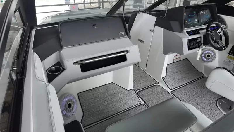 Slide: The Image of The image shows the cockpit of a 2026 Cobalt R4 Surf boat with modern instruments. - 31