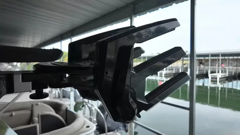 Slide: The Image of Close-up of a black boat detail in a covered dock area. - 43