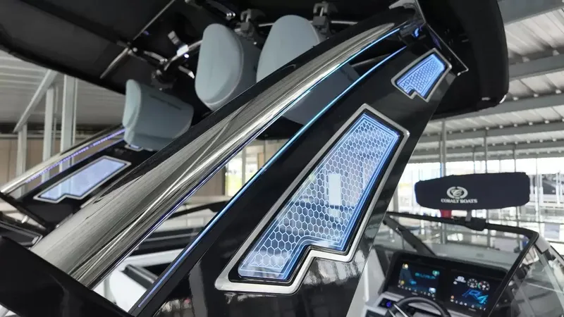 Slide: The Image of The image shows the modern dashboard of a Cobalt R4 Surf boat with a futuristic design. - 37