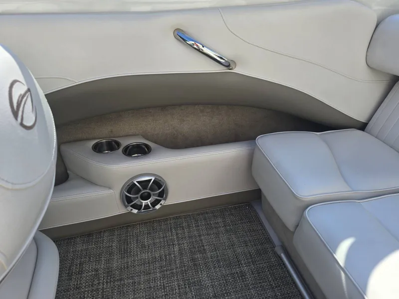 Slide: The Image of Interior of a 2016 Crownline 21 SS with gray upholstery and speaker. - 26