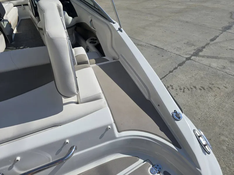 Slide: The Image of The image shows the cockpit of a 2016 Crownline 21 SS boat with beige upholstery. - 9