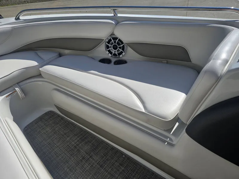Slide: The Image of The image shows the interior of a 2016 Crownline 21 SS boat with sleek seating. - 23