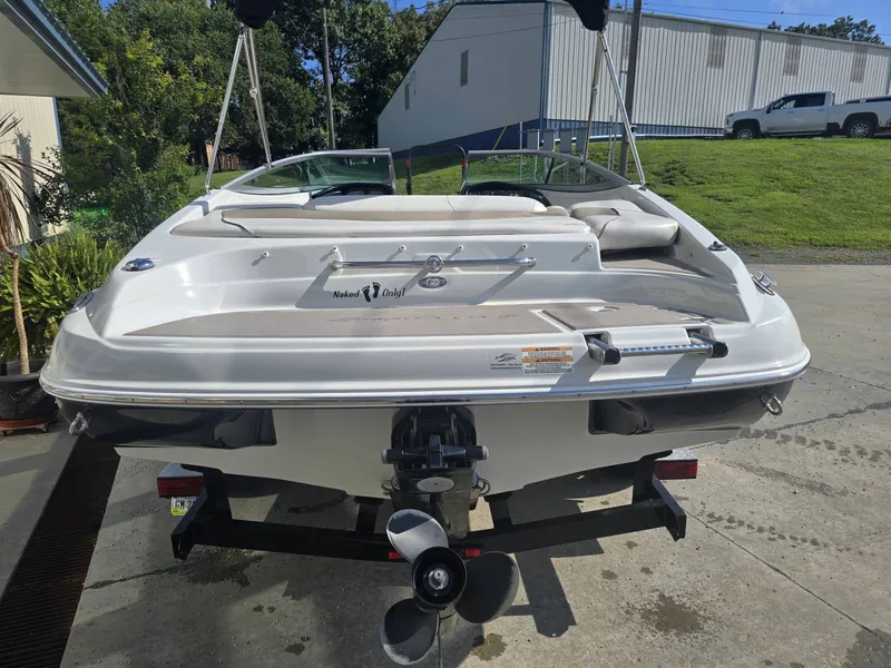 Slide: The Image of A 2016 Crownline 21 SS boat on a trailer in a yard. - 7