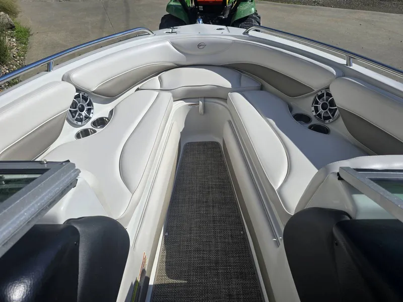Slide: The Image of The image shows the cockpit of a 2016 Crownline 21 SS boat with white leather seating. - 21