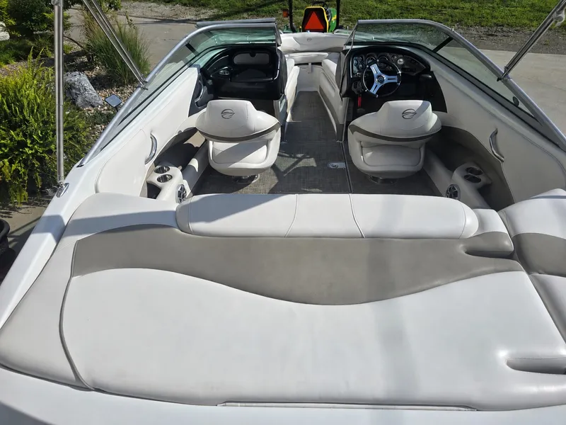 Slide: The Image of The image shows the cockpit of a 2016 Crownline 21 SS boat with white seating. - 8
