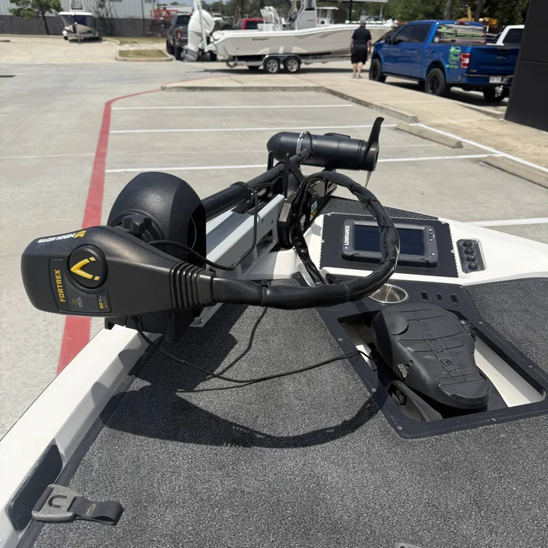 Slide: The Image of A 2019 Ranger Z518 with a Minn Kota trolling motor on the bow deck, parked in a lot. - 30