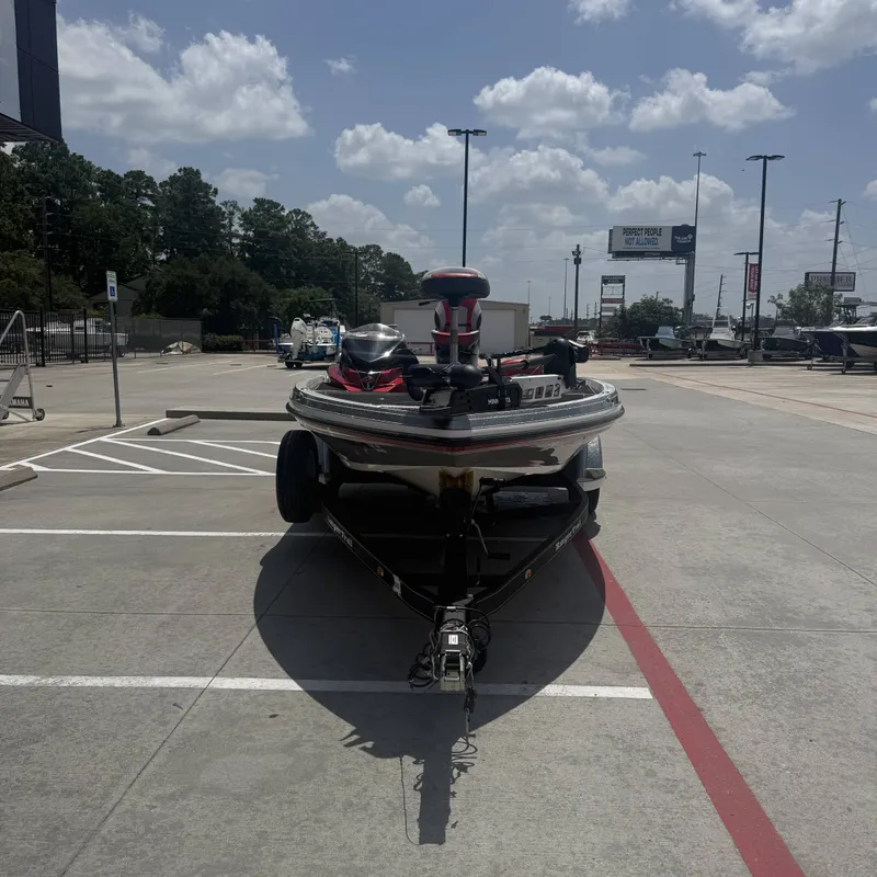 Slide: The Image of A 2019 Ranger Z518 boat on a trailer in a parking lot. - 5