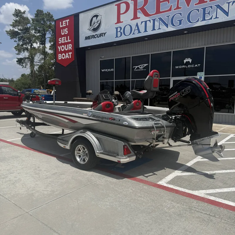 Slide: The Image of A silver 2019 Ranger Z518 boat on a trailer outside a boating center. - 10
