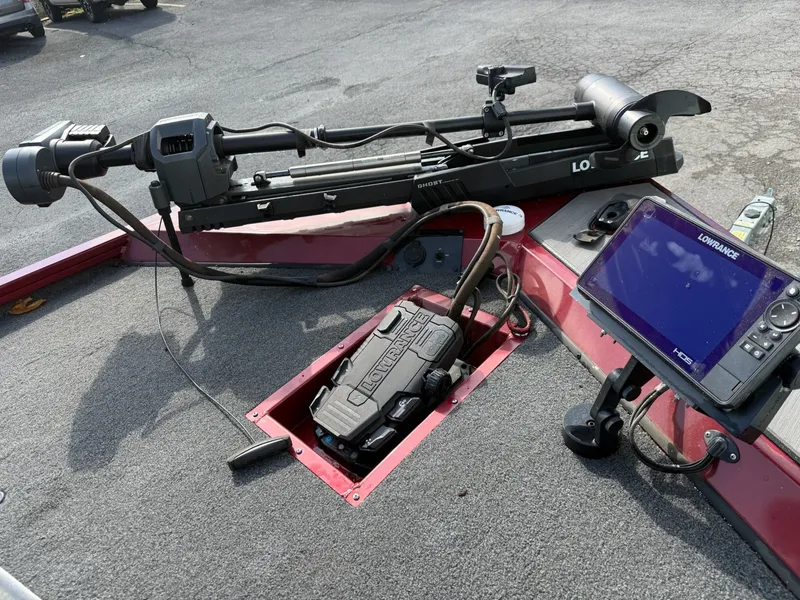 Slide: The Image of The image shows the cockpit of a 2023 Lowe Stinger 178 boat with a fish finder and trolling motor. - 15