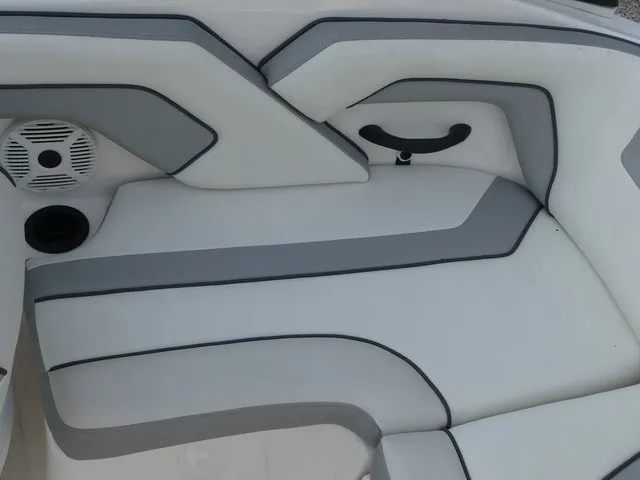 Slide: The Image of The interior of the 2018 Yamaha AR190 features white and gray upholstery with a speaker. - 21