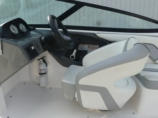 Slide: The Image of Interior of a 2018 Yamaha AR190 with gray and white seat, steering wheel, and dashboard. - 22