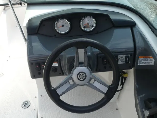 Slide: The Image of The image shows the helm of a 2018 Yamaha AR190 boat with two gauges. - 23