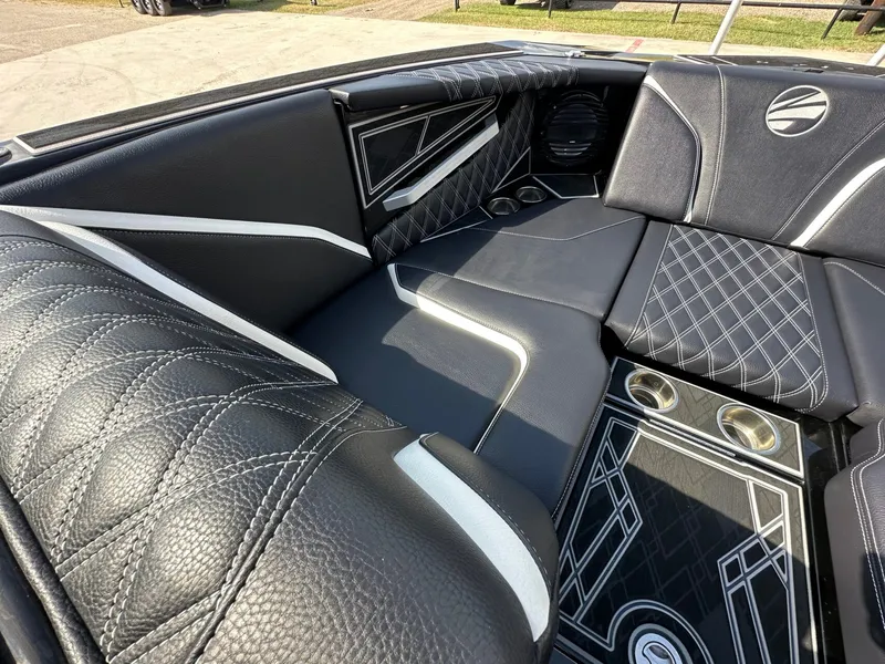 Slide: The Image of The image shows luxurious black upholstery with white accents inside a boat. - 20