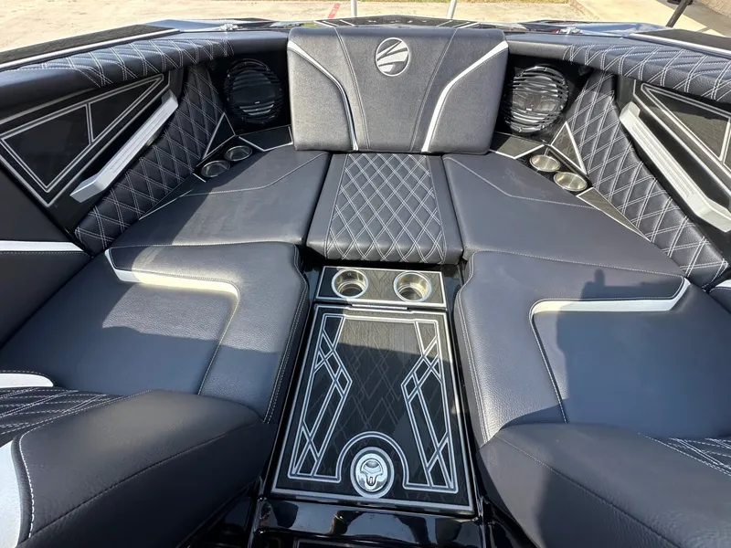 Slide: The Image of Luxurious interior of a 2024 Tigé 22RZX with black upholstery and sleek stitching. - 21