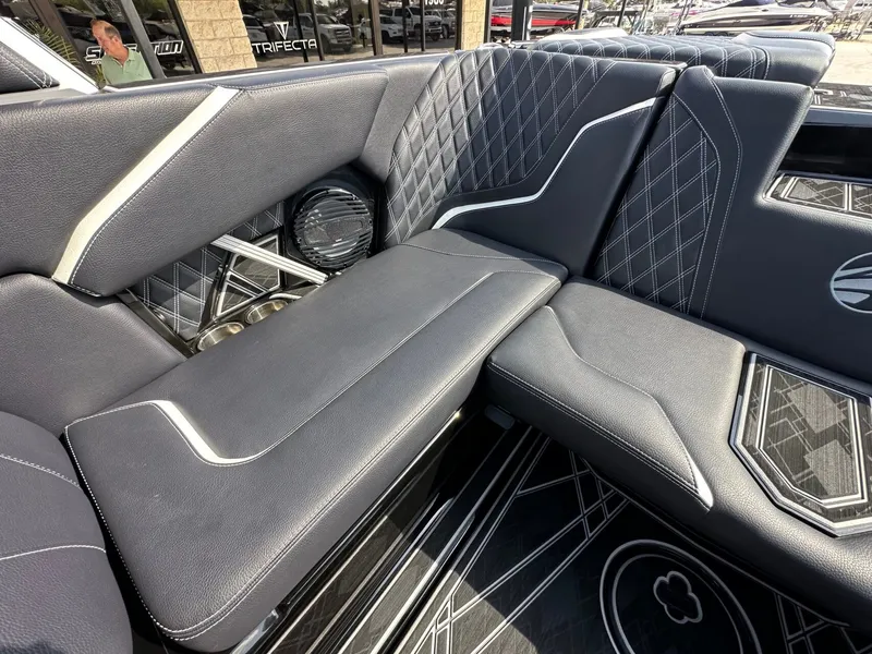 Slide: The Image of The image shows the luxurious interior of a 2024 Tigé 22RZX with elegant, quilted upholstery. - 12