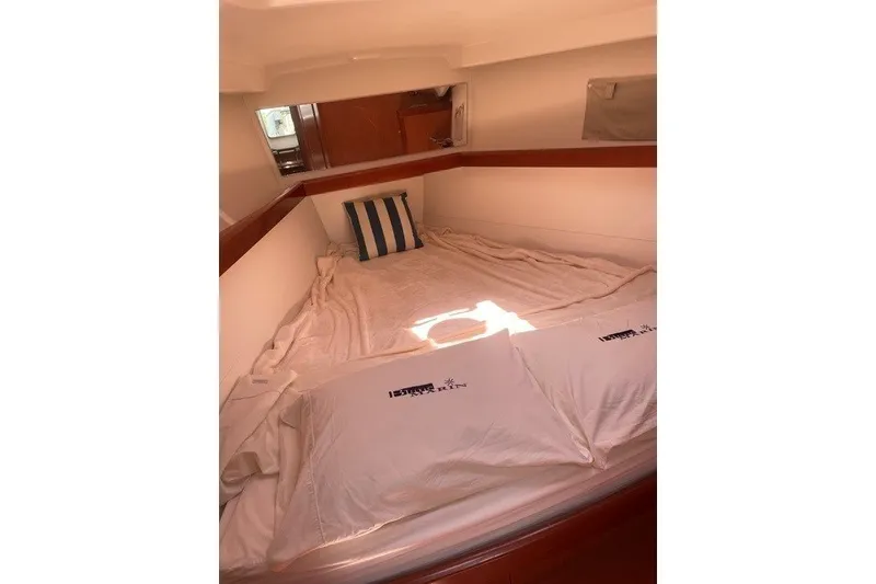 Slide: The Image of Cozy cabin interior of 2011 Beneteau Oceanis 43 sailboat with striped pillow. - 4
