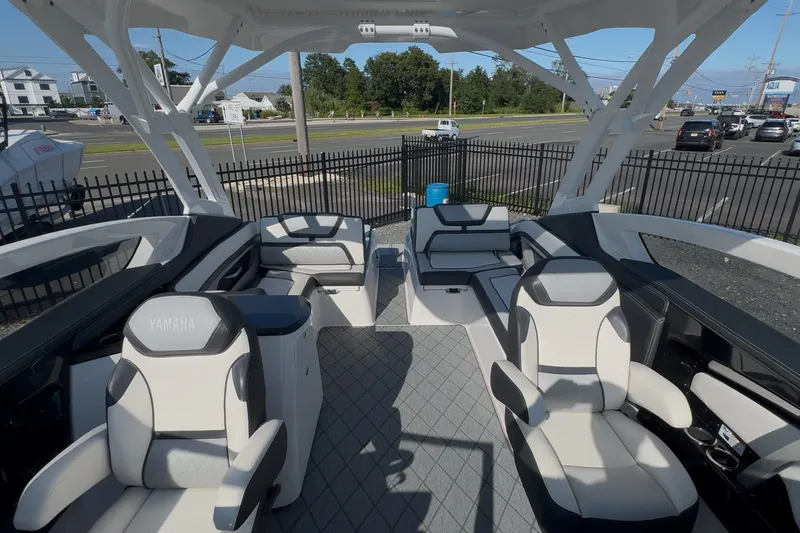 Slide: The Image of 2020 Yamaha Boats 275SD interior with luxurious seating and modern design. - 15