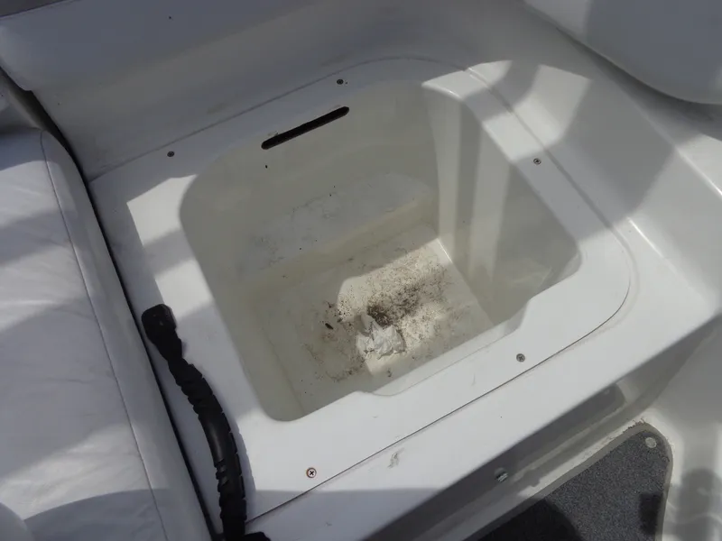 Slide: The Image of An open storage compartment on a 2008 Sea-Doo Sport Boat, model 180 Challenger. - 33