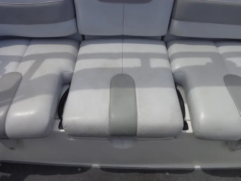 Slide: The Image of The rear seat of a Sea-Doo sport boat with gray and white upholstery. - 19