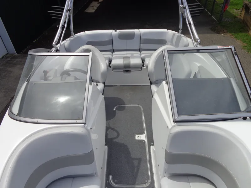 Slide: The Image of The image shows the cockpit of a 2008 Sea-Doo Sport Boat, model 180 Challenger, with gray seats and windshields. - 7