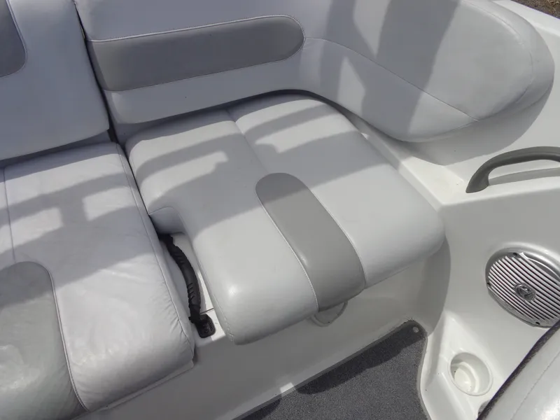 Slide: The Image of The interior of a Sea-Doo sport boat with gray upholstery and a speaker. - 20