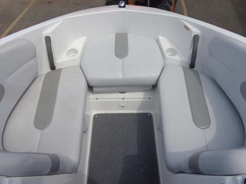 Slide: The Image of The image shows the bow area of a Sea-Doo sport boat with gray and white upholstery. - 17