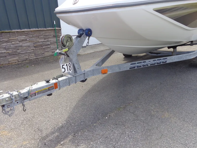 Slide: The Image of A 2008 Sea-Doo Sport Boats 180 Challenger on a trailer, parked on asphalt. - 48