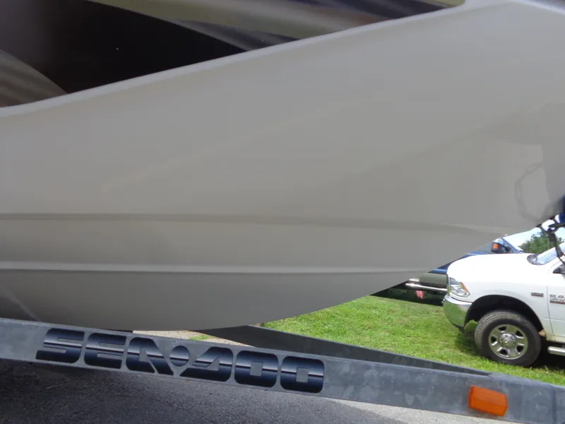 Slide: The Image of A 2008 Sea-Doo 180 Challenger on a trailer, partially visible with a vehicle in the background. - 49