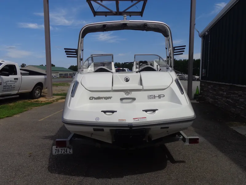 Slide: The Image of A white 2008 Sea-Doo Sport Boat, model 180 Challenger, is on a trailer. - 4