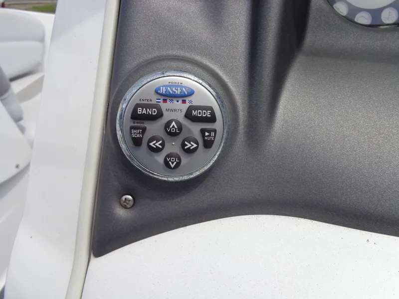 Slide: The Image of Close-up of a control panel featuring a Jensen audio controller on a Sea-Doo sport boat. - 16