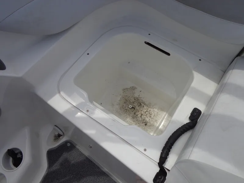 Slide: The Image of An open storage compartment on a 2008 Sea-Doo Sport Boat, model 180 Challenger. - 34