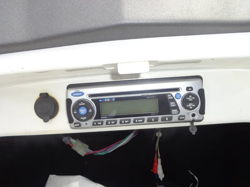 Slide: The Image of A radio and CD player is installed in the dashboard of a boat. - 14