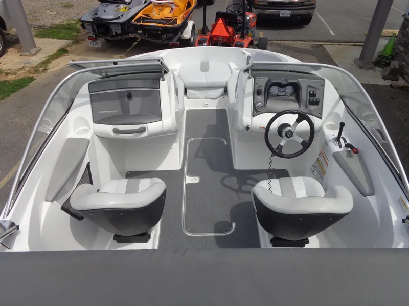 Slide: The Image of The image shows the cockpit of a 2008 Sea-Doo Sport Boat, 180 Challenger model, with two seats and a steering wheel. - 9