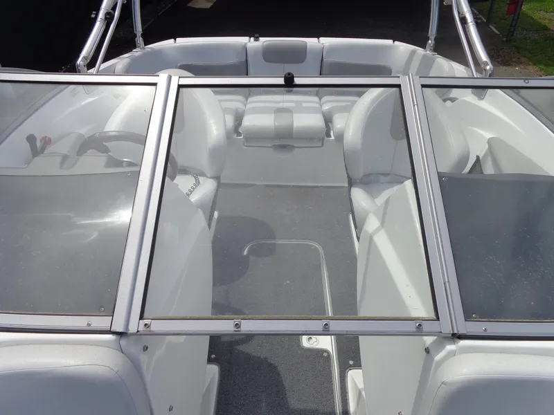 Slide: The Image of The image shows the cockpit of a Sea-Doo sport boat with gray seats and a split windshield design. - 8