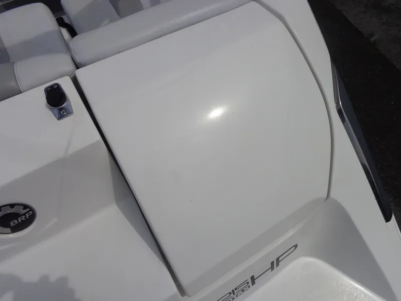 Slide: The Image of Close-up of a white boat part with BRP logo and 255 HP inscription. - 28