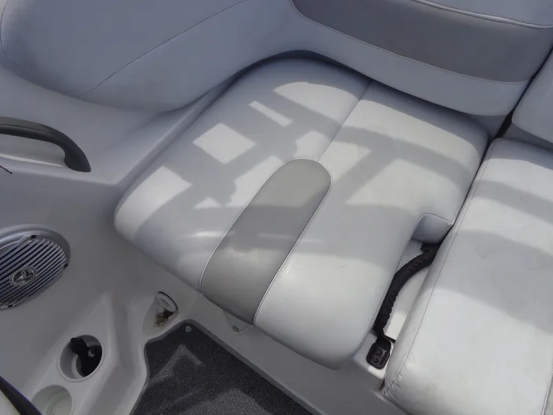 Slide: The Image of The image shows a gray seat in a boat with a speaker and a handrail. - 21