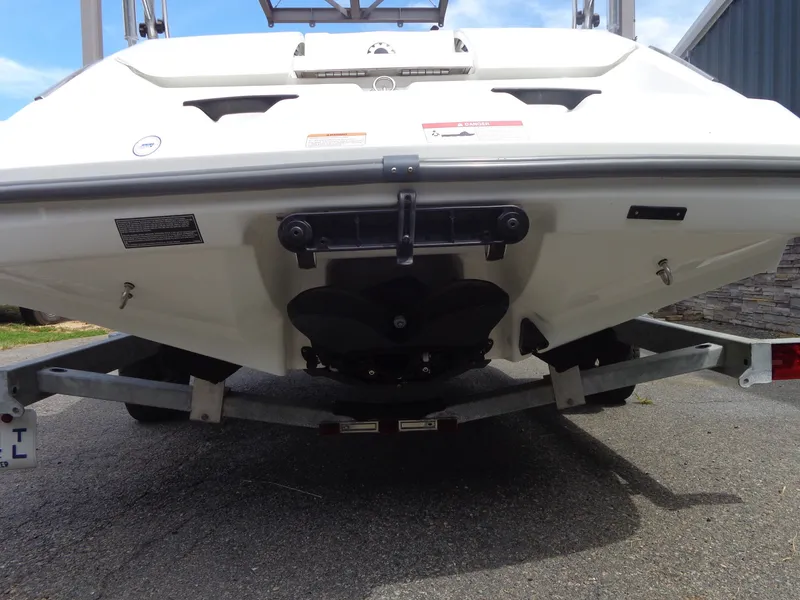 Slide: The Image of The image shows the stern of a white Sea-Doo sport boat on a trailer. - 6