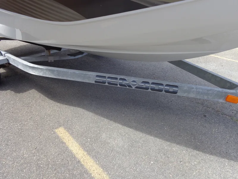 Slide: The Image of A Sea-Doo sport boat on a trailer, partially visible, with "Sea-Doo" lettering on the trailer. - 46