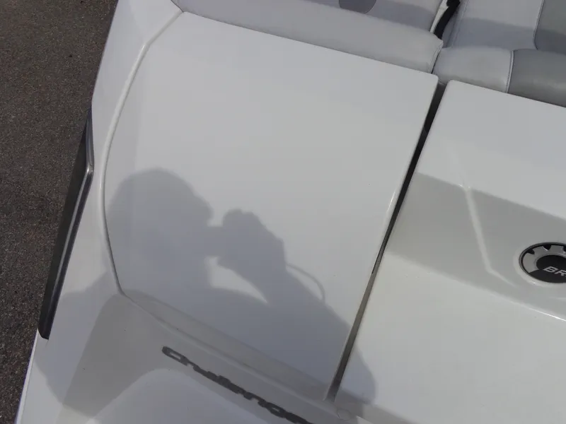 Slide: The Image of Close-up of a white boat seat with gray upholstery. A shadow is visible on the surface. - 29