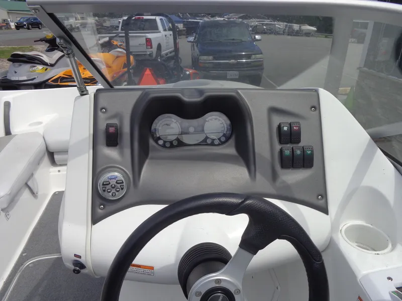 Slide: The Image of The image shows the cockpit of a 2008 Sea-Doo Sport Boat, 180 Challenger model, with steering wheel and instruments. - 10