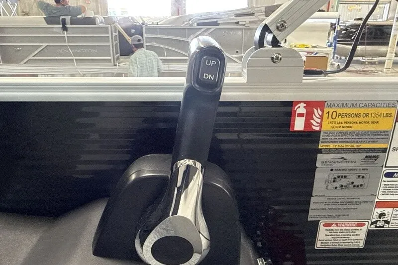 Slide: The Image of Throttle control of a 2027 Bennington S1 20 Cruise pontoon boat with capacity details. - 17