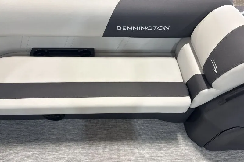 Slide: The Image of 2027 Bennington S1 20 Cruise boat seating, featuring sleek gray and white upholstery. - 13