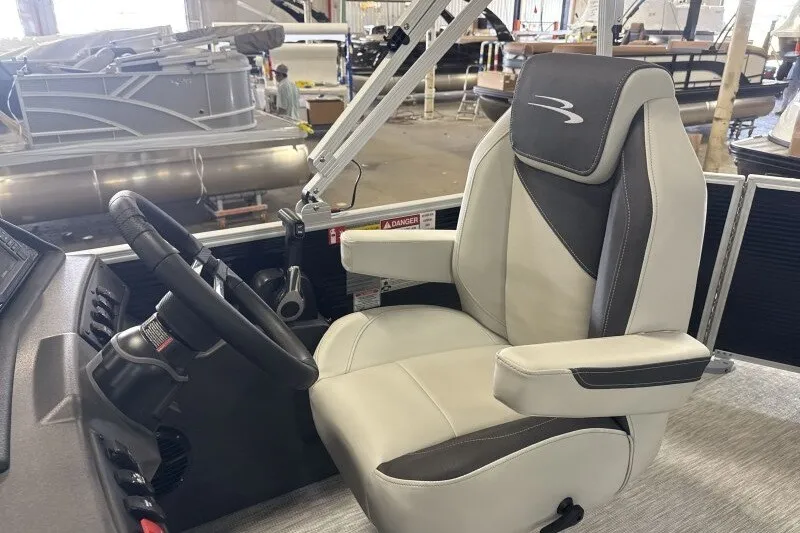 Slide: The Image of Captain's chair and steering wheel of 2027 Bennington S1 20 Cruise pontoon boat. - 15
