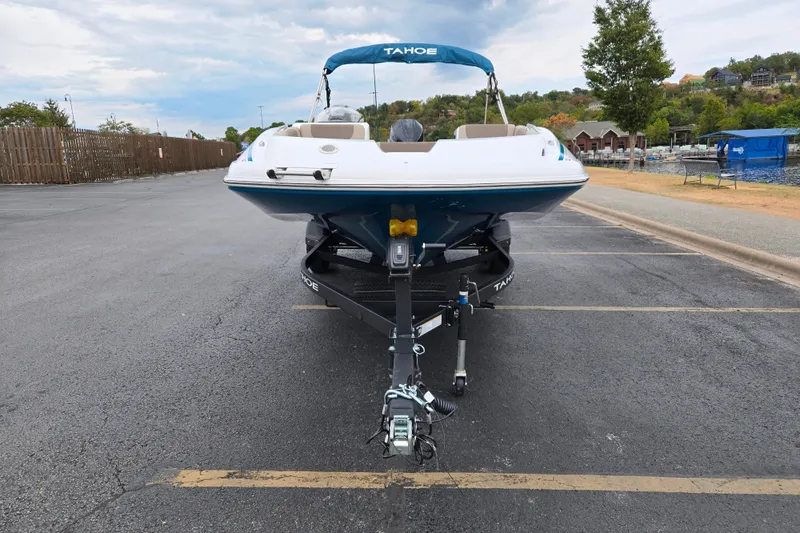 Slide: The Image of 2027 Tahoe 2150 boat on trailer in parking lot, ready for launch. - 2