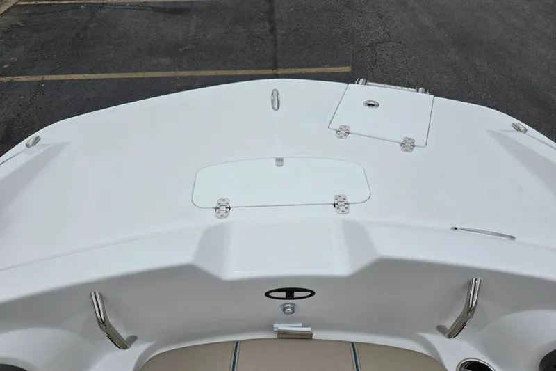 Slide: The Image of Bow view of a 2027 Tahoe 2150 boat, featuring storage compartments. - 14